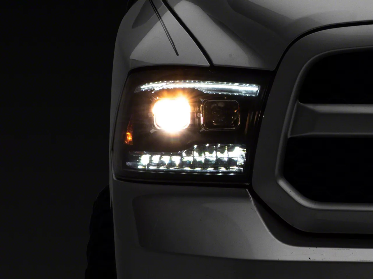 Raxiom LED Projector Headlights with Switchback Turn Signals; Black Housing; Clear Lens (09-18 RAM 1500 w/ Factory Halogen Non-Projector Headlights)